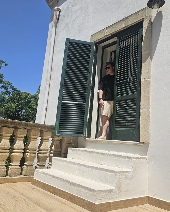 Rafi Friedmann standing in a sunlit doorway